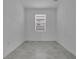 Empty bedroom with tile floor and window at 3087 Camden Way, Davenport, FL 33837