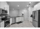 Kitchen with stainless steel appliances and gray countertops at 3087 Camden Way, Davenport, FL 33837