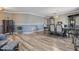 Stylish dining area featuring wood-look floors, two tone paint and classic chandelier at 3300 Pekin St, St Cloud, FL 34772