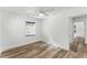 Bedroom with wood-look floors and ceiling fan at 3303 Helen Ave, Orlando, FL 32804