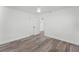 Bedroom with wood-look floors and double doors at 3303 Helen Ave, Orlando, FL 32804