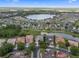 Beautiful aerial view showing the home and the proximity to the neighborhood lake and community at 408 Chelsea Ave, Davenport, FL 33837