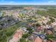 Beautiful aerial view of a Primary-planned community featuring lush landscaping, ponds, and luxurious single-Gathering homes at 408 Chelsea Ave, Davenport, FL 33837