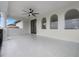 Spacious balcony with sleek tile flooring, ceiling fan, and arched windows offering abundant natural light at 408 Chelsea Ave, Davenport, FL 33837