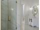 Modern bathroom with marble-walled shower, sleek vanity with gold hardware, and a bright, clean design at 408 Chelsea Ave, Davenport, FL 33837