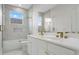 Elegant bathroom featuring dual sinks, a glass shower, and marble accents at 408 Chelsea Ave, Davenport, FL 33837