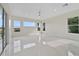Bright and airy bedroom features marble floors and large windows at 408 Chelsea Ave, Davenport, FL 33837