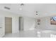 Bright bedroom with white marble floors, ceiling fan, closet and window views at 408 Chelsea Ave, Davenport, FL 33837