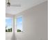 Sunny bedroom with large window overlooking lush greenery and plenty of natural light at 408 Chelsea Ave, Davenport, FL 33837
