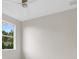 Bright bedroom featuring a single window, providing ample natural light at 408 Chelsea Ave, Davenport, FL 33837