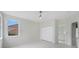 Bedroom with white marble floors, ceiling fan, closet, and bathroom access at 408 Chelsea Ave, Davenport, FL 33837