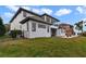 Exterior view of the home and backyard; a well manicured lawn enhance the property's curb appeal at 408 Chelsea Ave, Davenport, FL 33837