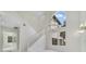 Bright foyer features high ceilings, statement chandelier, and staircase at 408 Chelsea Ave, Davenport, FL 33837