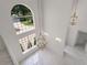 Bright foyer features a high ceiling, large windows, and an elegant chandelier at 408 Chelsea Ave, Davenport, FL 33837