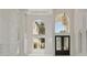 Grand foyer with soaring ceilings, elegant chandelier, and stunning staircase at 408 Chelsea Ave, Davenport, FL 33837