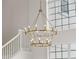 Bright, grand foyer with a stunning chandelier and view of the staircase and large windows at 408 Chelsea Ave, Davenport, FL 33837