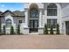 Stunning front entrance featuring grand pillars and large windows at 408 Chelsea Ave, Davenport, FL 33837
