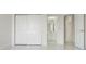 Hallway with glossy tiled floor and multiple doorways at 408 Chelsea Ave, Davenport, FL 33837