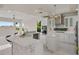 Open-concept kitchen boasts a breakfast bar, stainless appliances, and ample counter space at 408 Chelsea Ave, Davenport, FL 33837