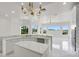 Bright kitchen showcases a center island, modern fixtures, and plenty of natural light at 408 Chelsea Ave, Davenport, FL 33837