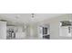 Open-concept living area has marble floors and an attached kitchen at 408 Chelsea Ave, Davenport, FL 33837