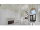Spacious living room features high ceilings, fireplace, and marble flooring at 408 Chelsea Ave, Davenport, FL 33837