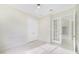 An office space featuring marble floors, chair rail, an interior window and a glass door at 408 Chelsea Ave, Davenport, FL 33837