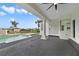 Covered outdoor living space featuring a beautiful pool and spa, perfect for entertaining guests or relaxing at 408 Chelsea Ave, Davenport, FL 33837