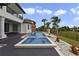 The backyard includes a private pool, spa, and meticulous landscaping at 408 Chelsea Ave, Davenport, FL 33837