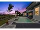 Backyard view showcasing the pool with spa and well-manicured lawn in a relaxing setting at 408 Chelsea Ave, Davenport, FL 33837
