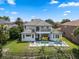 A lovely two-story house boasts a private pool and a meticulously kept lawn at 408 Chelsea Ave, Davenport, FL 33837