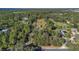 Aerial view of property showing house, outbuildings, and surrounding land at 4975 Disston Dr, St Cloud, FL 34771