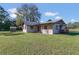 One story home with covered porch and flag at 4975 Disston Dr, St Cloud, FL 34771