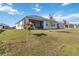 Landscaped backyard with a view of the lake at 6922 Audobon Osprey Cv, Harmony, FL 34773