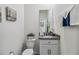 Small bathroom with granite countertop at 6922 Audobon Osprey Cv, Harmony, FL 34773