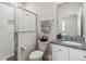 Clean bathroom with shower, toilet and granite vanity at 6922 Audobon Osprey Cv, Harmony, FL 34773