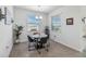 Casual dining area with a round table and four chairs, near a kitchen at 6922 Audobon Osprey Cv, Harmony, FL 34773