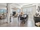 Bright dining room with dark wood table and chairs at 6922 Audobon Osprey Cv, Harmony, FL 34773