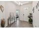 Bright and spacious entryway with tile floors and a console table at 6922 Audobon Osprey Cv, Harmony, FL 34773