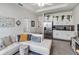 Open kitchen with white cabinets and granite countertops at 6922 Audobon Osprey Cv, Harmony, FL 34773