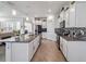 Open concept kitchen boasting granite countertops and white cabinetry at 6922 Audobon Osprey Cv, Harmony, FL 34773