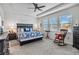 Spacious main bedroom with a king-size bed and plenty of natural light at 6922 Audobon Osprey Cv, Harmony, FL 34773