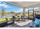 Relaxing screened porch overlooking a tranquil lake at 6922 Audobon Osprey Cv, Harmony, FL 34773