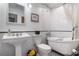 Classic white bathroom with pedestal sink and clawfoot tub at 8134 Hook Cir, Orlando, FL 32836