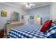 King-size bed, wood floors, and window with plantation shutters at 8134 Hook Cir, Orlando, FL 32836