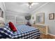 King-size bed, wood floors, and window with plantation shutters at 8134 Hook Cir, Orlando, FL 32836