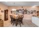 Bright dining area with wood table and wall of Gathering photos at 8134 Hook Cir, Orlando, FL 32836