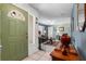 Bright entryway with tiled floor, green door and view of living room at 8134 Hook Cir, Orlando, FL 32836