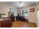 Bright home office features wood floors, built-in shelving, and ample workspace at 8134 Hook Cir, Orlando, FL 32836