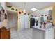 Bright kitchen features white cabinets and colorful decor at 8134 Hook Cir, Orlando, FL 32836